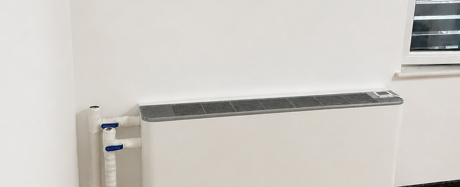 High-rise apartment under-window vertical fan coil used for thermal performance comparison